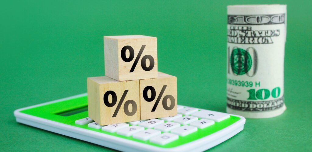 calculator wooden cube with percent icon and a ro 2025 03 08 01 32 09 utc scaled e1752468477303