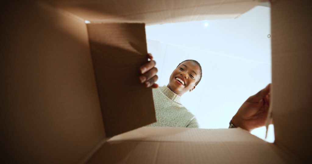 A young woman reviewing a 10-step guide to buying her first home