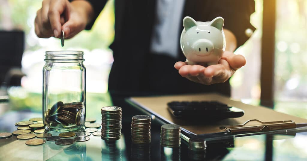 How to Start Saving for a House in 2026: Financial Prep Part 1 1 Person saving coins in piggy bank